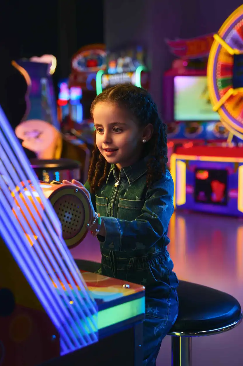 A young girl playing in play area of the mall